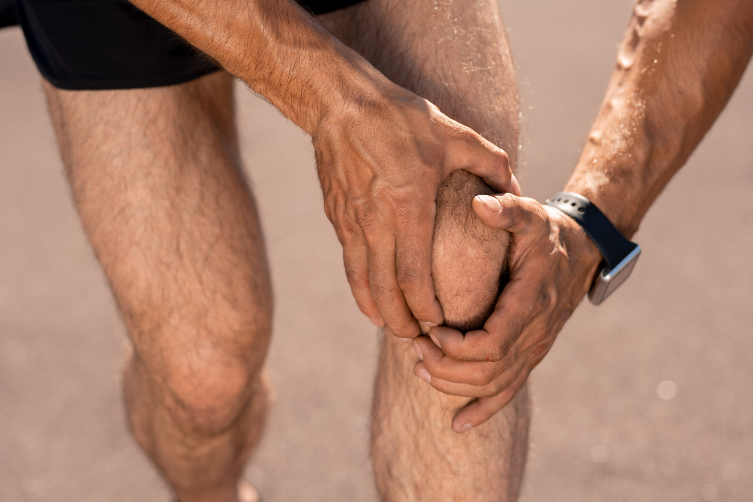 5 considerations for your triathlon training program hurt knee KDXJGLY scaled 1 5 considerations for your triathlon training program