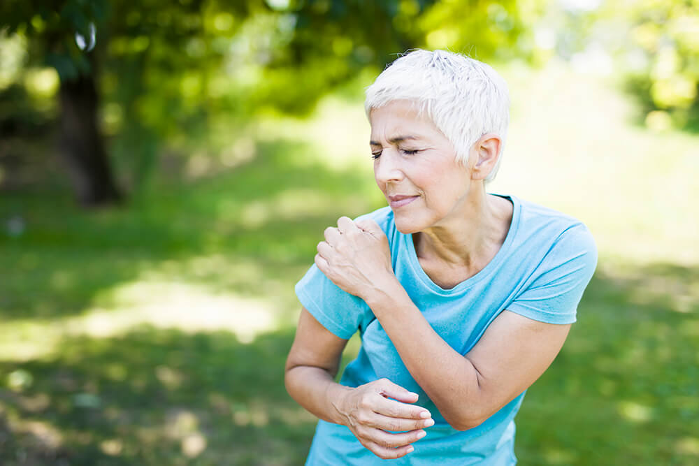 Labrum tear vs. rotator cuff tear: How do the symptoms differ? senior sporty woman has shoulder pain in the park 2022 04 08 01 42 30 utc Labrum tear vs. rotator cuff tear: How do the symptoms differ?