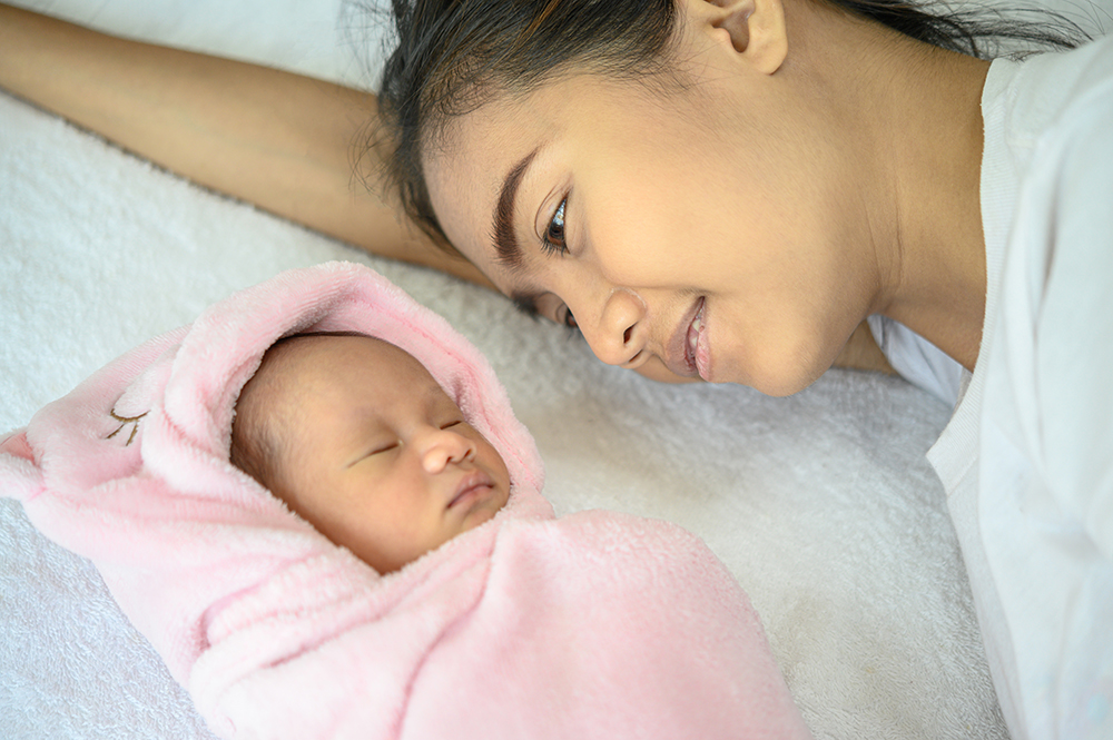 What factors may lead to tailbone pain after a C-section?